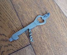 Bottle opener and corkscrew