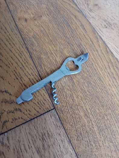 Bottle opener and corkscrew