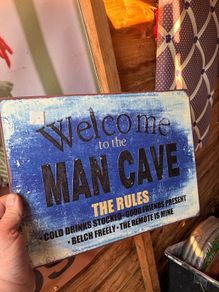 Metal man cave sign