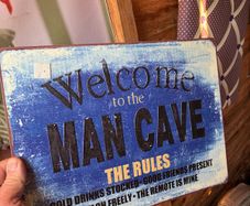 Metal man cave sign