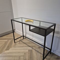 IKEA  (glass top with black metal frame and side shelf).