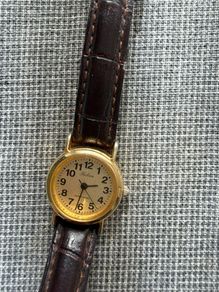 Ladies Q&Q (Citizen) Falcon gold-tone quartz watch, brown leather strap