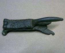 Old ornate cast iron cork presser