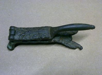 Old ornate cast iron cork presser