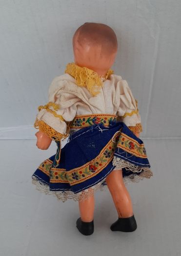 Small vintage rubber doll in costume