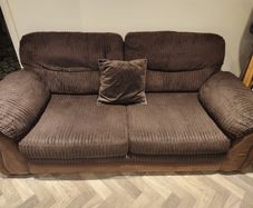 Two seater brown fabric sofa