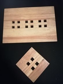 A beautiful set of hardwood tableware, consisting of 4 place mats and 4 matching coasters