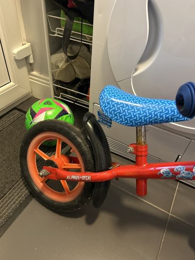 Two toddler bikes and a balance bike