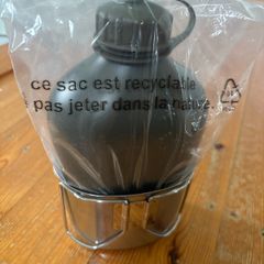 Genuine army-style metal water bottle with matching nesting cup. Military surplus
