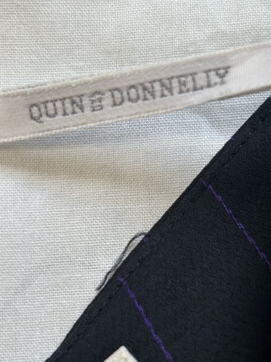 Quin and Donnelly Black with purple pin stripe and panel skirt