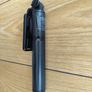 black extendable selfie stick and mini-tripod featuring a detachable wireless Bluetooth remote. Image 2