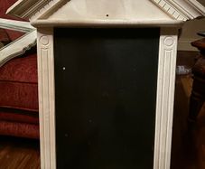 Ornate painted wooden blackboard
