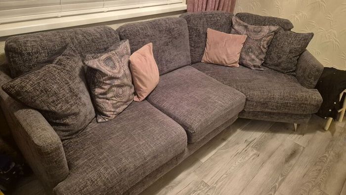 Grey corner couch with 6 matching cushions