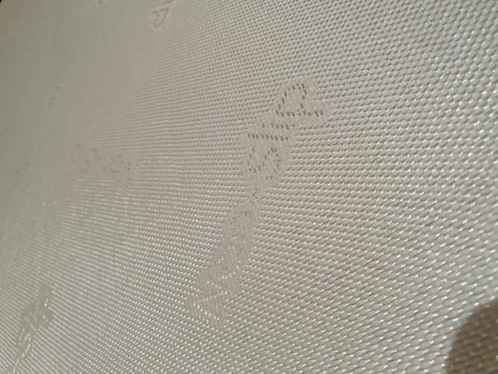 Single divan bed with pristine clean mattress and space for headboard