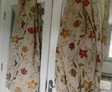 Red burnt orange flower print / cream curtains