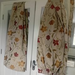 Red burnt orange flower print / cream curtains