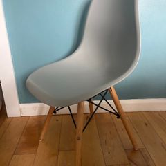 Chairs- modern molded plastic side chair with a minimalist Scandinavian-inspired design.