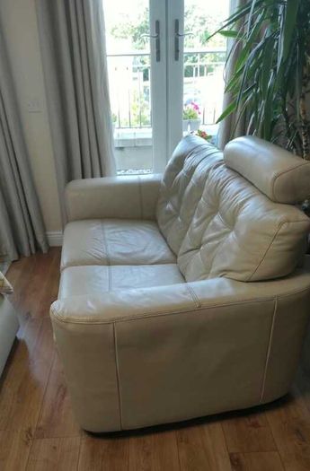 Two-seater cream leather sofa