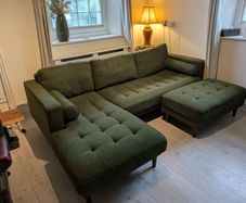 Cooper green fabric corner sofa with left hand facing chaise. Footstool included. In perfect condition.
