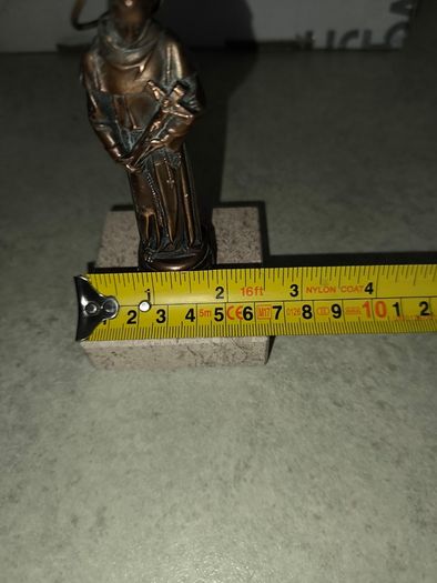 Copper Sacred art statue of Saint Francis of Assisi on marble plinth.