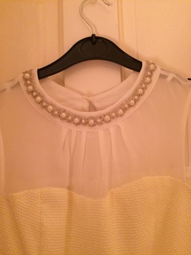 Dress with pearl neckline