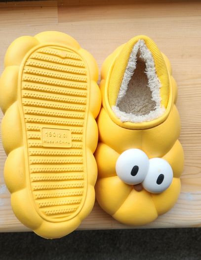 Child's plush lined yellow funny eyes slippers