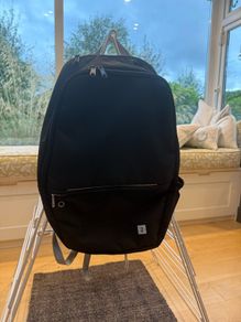 Black back pack, 3 pockets and a side net