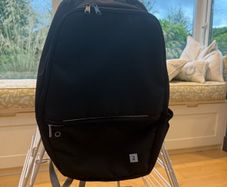 Black back pack, 3 pockets and a side net