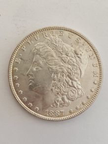 Aunc 1887 morgan silver dollar