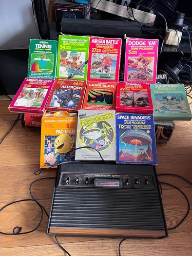 Atari 2600 Space Invaders Woody Atari 2600 with 15 individual games and 14 game Indy 500 driving