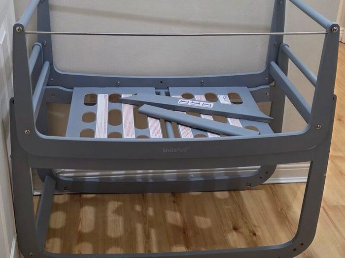 Dark gray bed side cot.