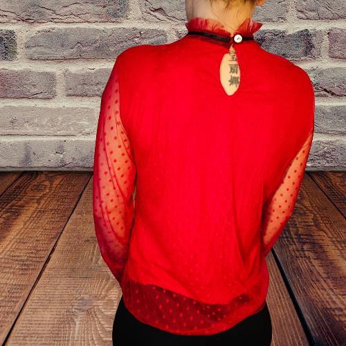 Lace blouse with a bow at the neck