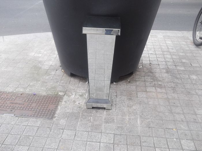 a shops display stand with mirror all round it