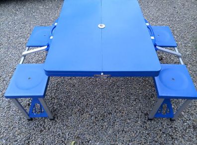 Foldable camping table with seats