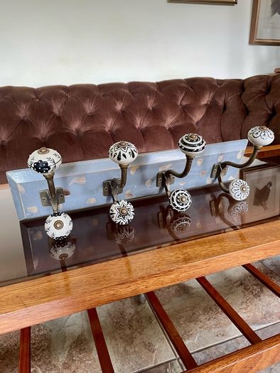 New Unused Stylish Entryway Mounted Ceramic and Brass Coat Hanger