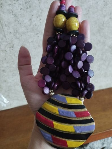 Vintage spectacular necklace made of wooden beads and medallion.