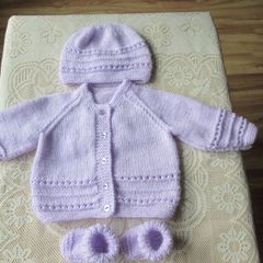 Hand knitted Baby Cardigans hats & booties.