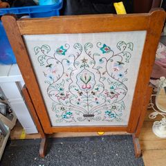 fire screen featuring a hand-embroidered floral needlepoint panel.