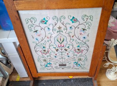 fire screen featuring a hand-embroidered floral needlepoint panel.