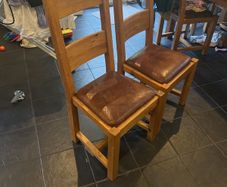 Reduced to sell  4 solid kitchen chairs with brown leather seats