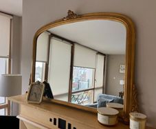 Gold mirror over mantle