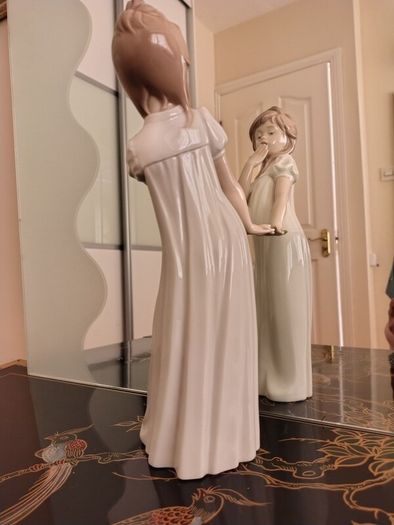 Nao by Lladro.  Yawning Girl. Damaged.