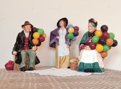 Vintage porcelain figurines family of balloon sellers by Royal Doultot . 85 euro each