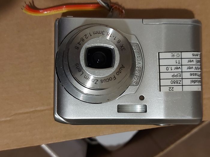 Z880 Digital Camera, Takes 2AA Batteries, working fine, has a modification that doesn't affect its performance