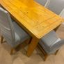 Large Extendable Solid Wood Dining Table & 8 Chairs (Covers Included) Image 2