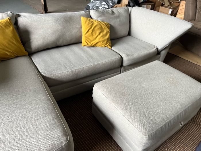 Grey corner sofa with matching footstool