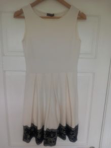 White dress with black lace trim