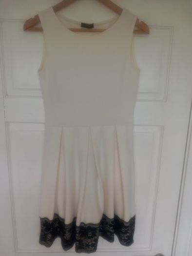 White dress with black lace trim
