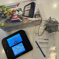 Nintendo 2ds with box and Mario kart game
