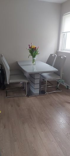 gray extending dining table and 4 chairs